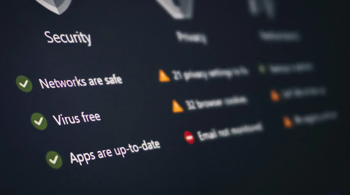 A device security screen at an angle, ticks beside Networks are safe, Virus free and Apps are up-to-date.